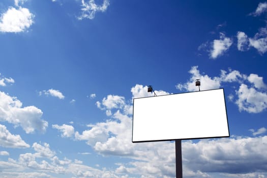 Billboard and a brilliant blue sky with clouds.