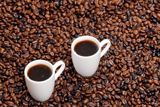 still life of coffee cups and coffee beans