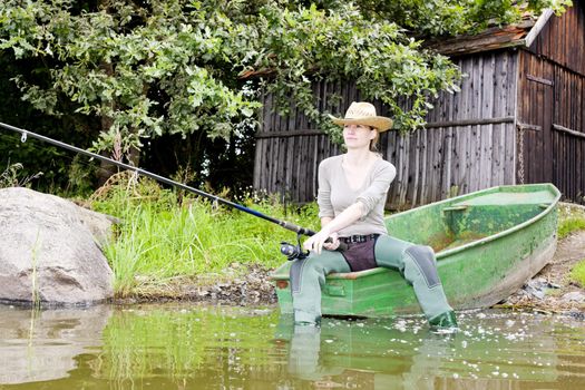 fishing woman sitting on boat