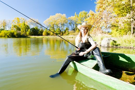 fishing woman sitting on boat