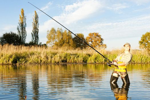 woman fishing in pond