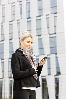 portrait of young businesswoman with a mobile