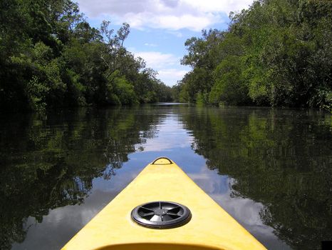 Canoe that looks like a banana on the river