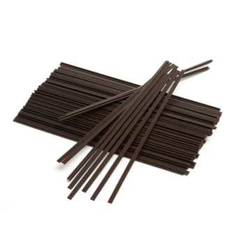 An isolated group of disposable coffee stir sticks that you would find at most cafes.