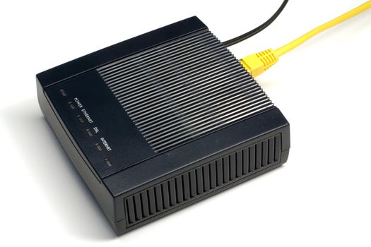 Black ADSL modem with connected LAN and phone wires