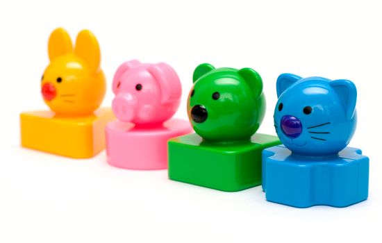 Color animal toys standing in a row