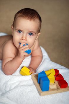 Cute baby playing bricks