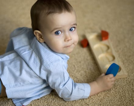 Portrait of  boy playing with intellectual toy