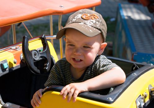 Portrait of the whimpering child in the attraction