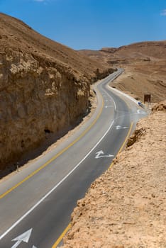 A long winding road in desert 