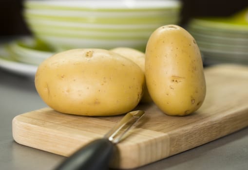 group of potatoes waiting on breadboard