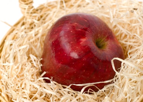 Close up view of red apple on straw