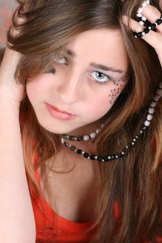 Teenage girl with face paint and fashionable jewellery
Beautiful teenage female with an angelic face