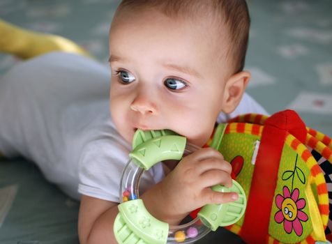 Portrait of a baby with toys