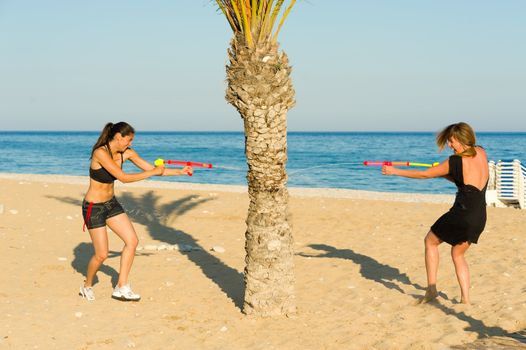 Girls in an intense water pistol fight