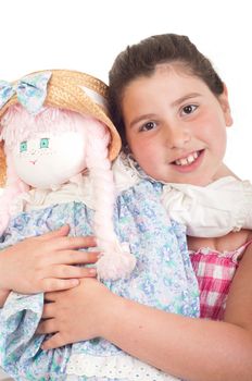 joyful little girl with her favorite doll (isolated on white background) 