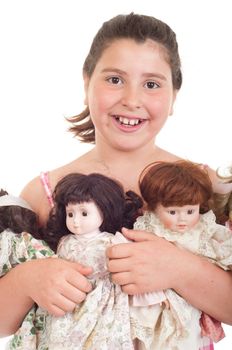 joyful little girl with her favorite dolls (isolated on white background) 