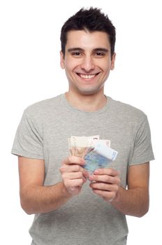 smiling young man showing his money, euro bills (isolated on white background)