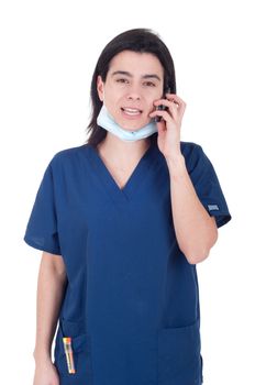 busy female doctor in uniform talking on the phone (isolated on white background)