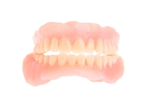 full set of a acrylic denture isolated on white background