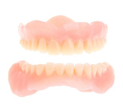 full set of a acrylic denture isolated on white background
