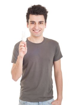 smiling casual man holding a energy-saving lightbulb isolated on white background