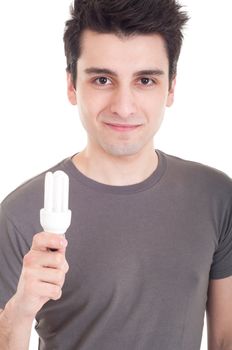 happy casual man holding a energy-saving lightbulb isolated on white background