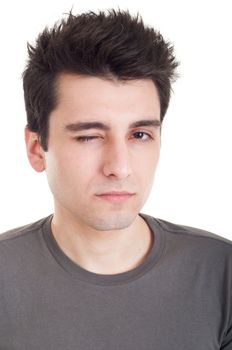 serious young man winking isolated on white background