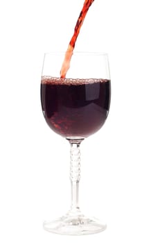 red wine pouring into a crystal glass (isolated on white background)