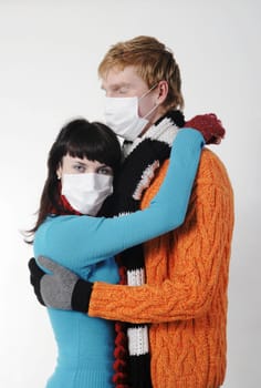 man embraces a woman wearing masks, flu, A(H1N1)