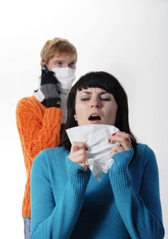 girl was ill of influenza, a man stands behind a mask A(H1N1)