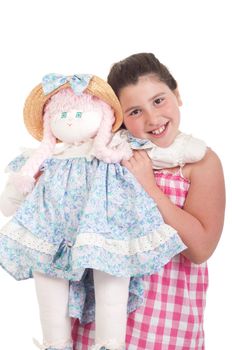 joyful little girl with her favorite doll (isolated on white background) 