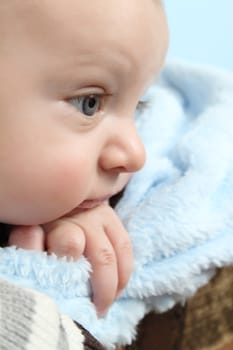 Beautiful baby boy staring into the distance
