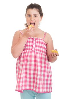 cute little girl with hungry expression eating chips (isolated on white background)