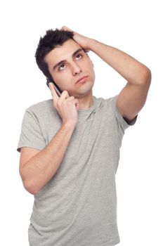 stressed young casual man talking on the phone (isolated on white background)