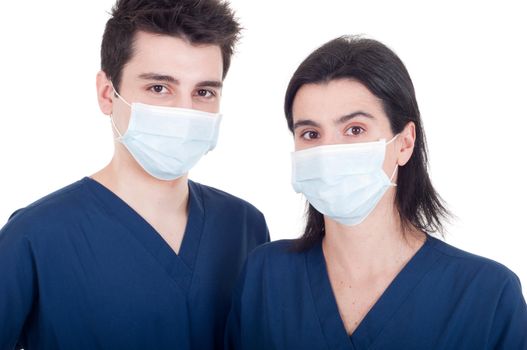 portrait of a team of doctors, man and woman wearing mask and uniform isolated on white background