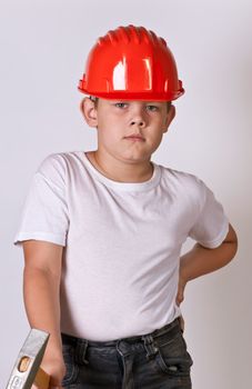 Portrait of a boy in a red protective helmet