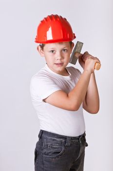 Portrait of a boy in a red protective helmet