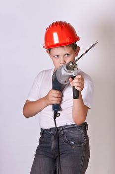 Portrait of a boy in a red protective helmet