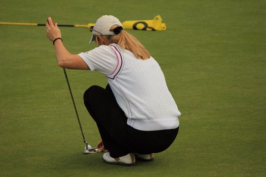 Golf player and grass green