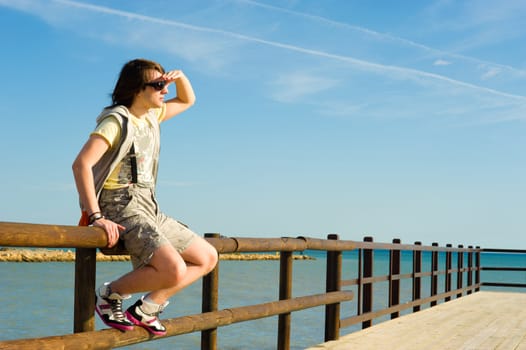 Teen looking out towards the horizon, a future concept