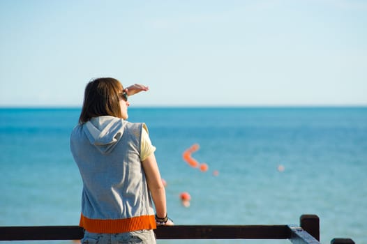 Teen looking out towards the horizon, a future concept