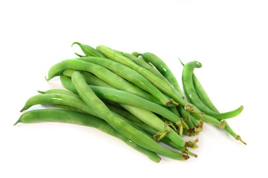 fresh green beans on a white background