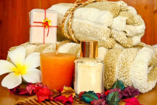 Spa products with flowers and towel