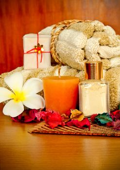 Spa products with flowers and towel
