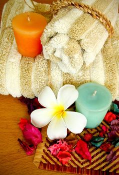 Spa products with flowers and towel
