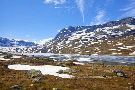 Snowcapped mountains and water at Haukeli, Norway