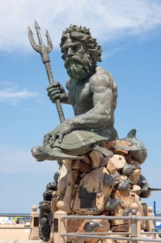 A large public statue of King Neptune  that welcomes all to VA beach in Virginia USA.