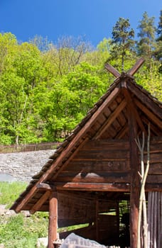 Wooden hut in country landscape, trees, wood