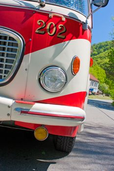 Old bus white and red on the road